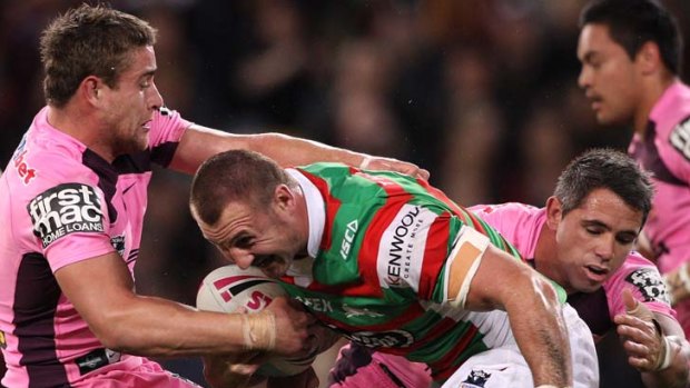Lessons learned ... Rabbitohs forward Scott Geddes takes on the Broncos defence on Friday night in a game South Sydney co-captain Michael Crocker described as one of the fastest he's played.
