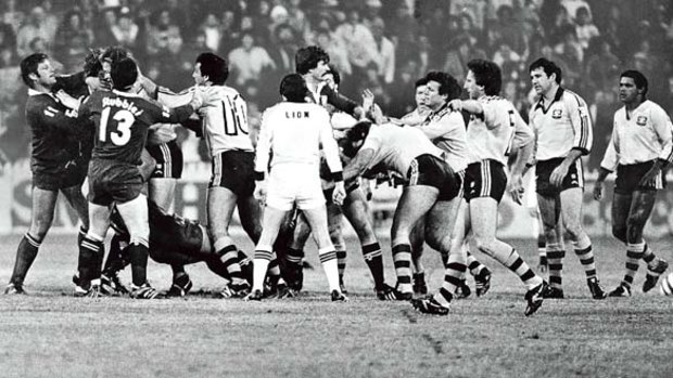 Actions speak louder than words ... players sort out a difference of opinion during an Origin match at the SCG in 1983.