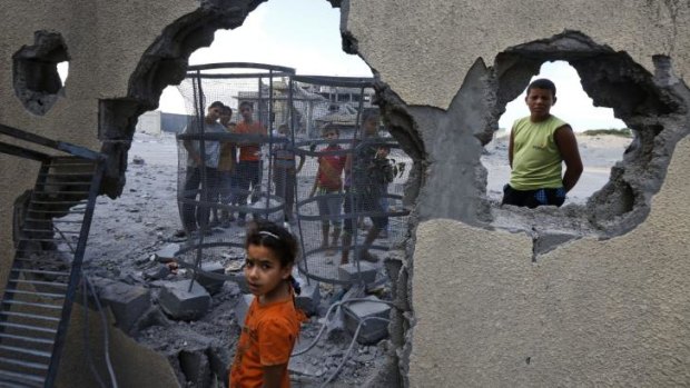 Palestinian children near the site of an Israeli missile strike in Rafah, southern Gaza Strip.