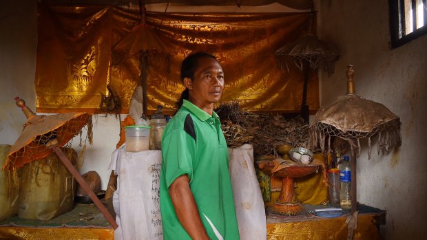 Balinese priest Jero Mangku Ada in his sacred room at his home in Temukus village in the Besakih area, 6km from the summit of Mount Agung. Jero Mangku Ada climbed to the crater yesterday after being asked by the gods to make an offering. Mount Agung is threatening to erupt. 30th September, 2017. 