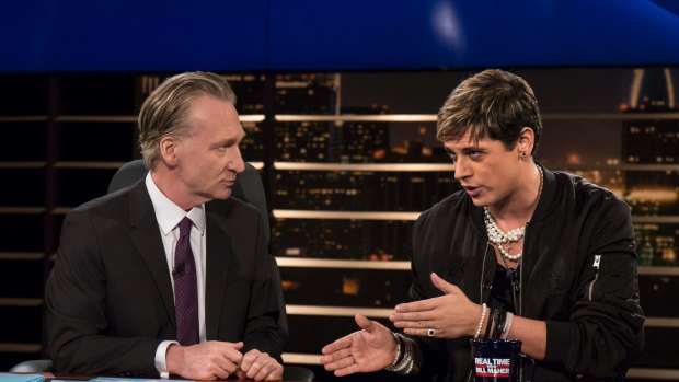 Bill Maher, left, listens to Milo Yiannopoulos, a writer for Breitbart News, on HBO's "Real Time with Bill Maher"