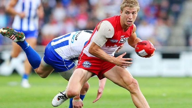 Aiming for back-to-back flags: Kieren Jack of the Swans runs from Jack Ziebell of the Kangaroos at Blundstone Arena on Saturday.