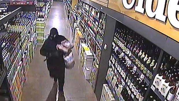 Dressed in black, the man allegedly using the van to steal items ranging from expensive bottles of alcohol to coffee machines.