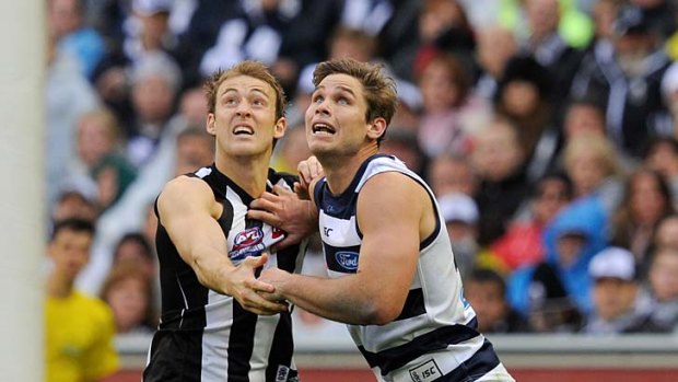 The battle between Magpie Ben Reid and Geelong's Tom Hawkins will be a key one tonight.