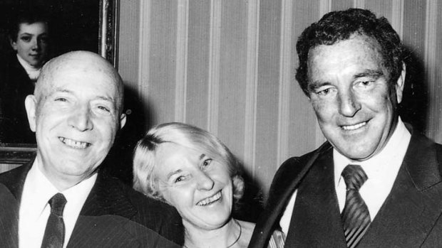 Travelled ... Scully, right, with his wife, Lorraine, and a French official.