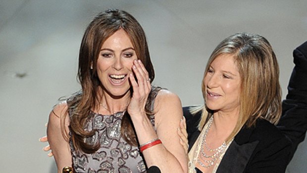 Kathryn Bigelow (left) collects an Oscar for  The Hurt Locker.