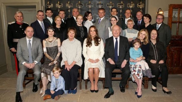 The Duchess of Cambridge poses with cast, crew and producers of Downton Abbey.