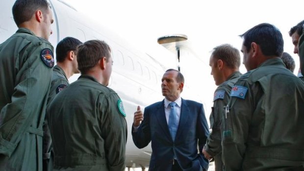 ''Flag patriot'' charge: Prime Minister Tony Abbott addresses troops at RAAF Base Williamtown.