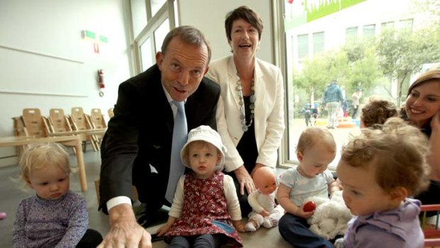 Tony Abbott with his wife Margie, meeting children as they visit the Capital Hill Early Childhood Centre in Parliament House.