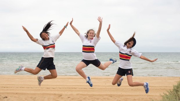 Senior school students celebrate their efforts during a house cross-country event.