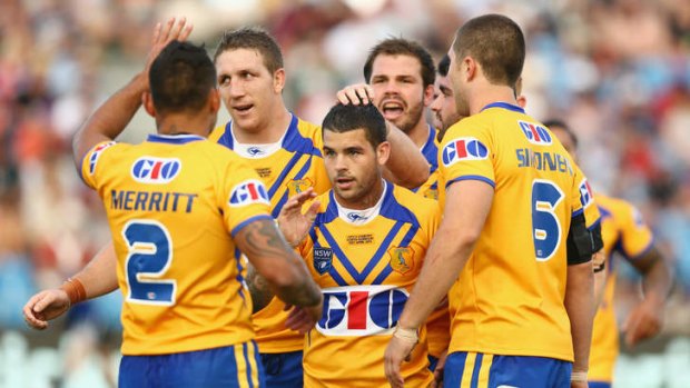 Adam Reynolds in congratulated by his teammates after scoring for City Origin.