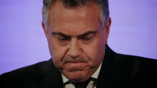 Treasurer Joe Hockey delivers the Mid-Year Economic and Fiscal Outlook at the National Press Club of Australia in Canberra on Tuesday.