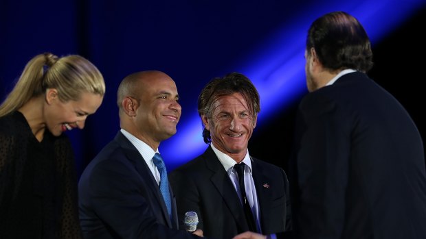 (L-R) Happy Hearts Fund founder Petra Nemcova, Haiti prime minister Laurent Lamothe and actor Sean Penn greet Salesforce chairman and CEO Marc Benioff at the 2013 Dreamforce conference.
