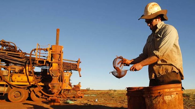 Falling iron ore prices are leading to job losses and project cuts.