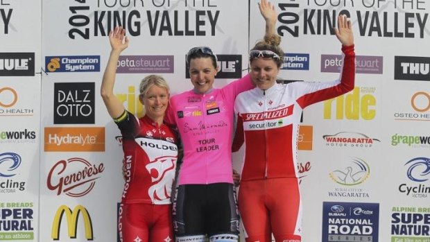 On the podium: Canberra cyclist and general classification winner Rebecca Wiasak is flanked by runner-up Ashlee Ankudinoff (right) and third place getter Ruth Corset (left).