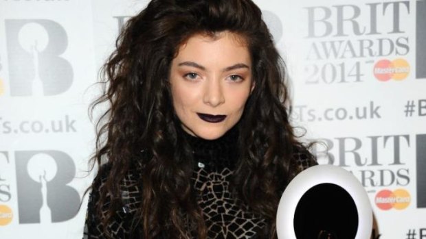 Lorde rocking Tom Ford and her signature purple lip at the Brits.