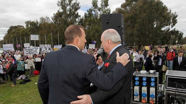 Protest message off pat  ...  Tony Abbott and Alan Jones at the rally.