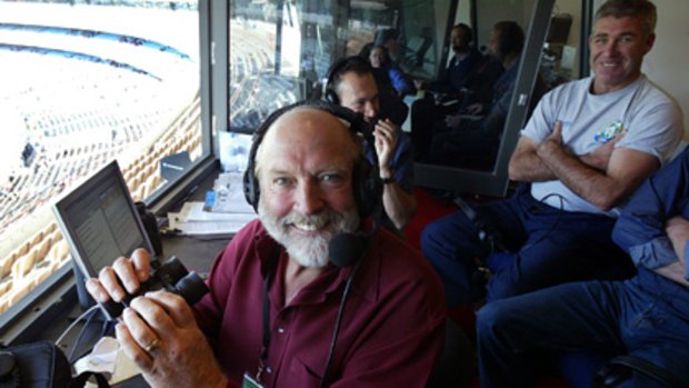 Doing what he does... Rex Hunt in the 3AW box at the MCG in 2004.