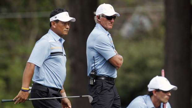 "Keep your head high ... it's a four-round tournament" ... Greg Norman, centre.
