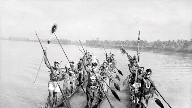 Sepik River tribesmen on their canoes in 1956. 