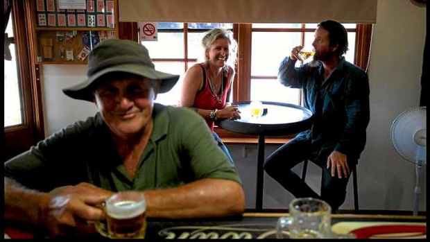 Cheers: Peter Booth (front), Skye Rhodes-Mitchell and Tommy Taylor cool off at the Thoona pub.