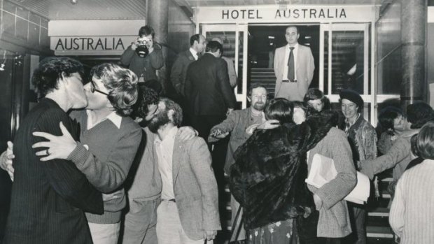 Melbourne, 1979. Protesters kiss outside the Australia Hotel after two men were convicted of the charge of offensive behaviour for kissing on the same spot.