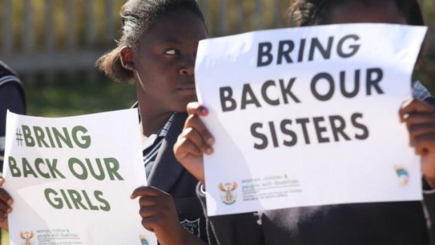 Students from a South African school hold posters to support the release of the kidnapped girls in Nigeria.