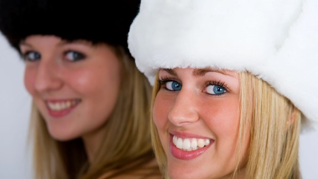 A7DE9P Two beautiful Russian women wearing fur hats shot in three quarter profile