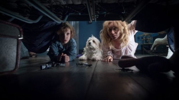 I know there's an explanation under here somewhere... Essie Davis and Noah Wiseman in <i>The Babadook</i>.