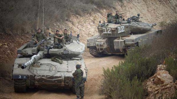 Israeli tanks near the site of an exchange of fire between Israeli and Lebanese troops.