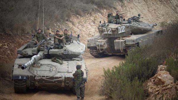 Israeli tanks near the site of an exchange of fire between Israeli and Lebanese troops.