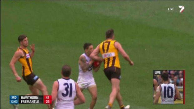Hawthorn's Brian Lake collides with Fremantle's Michael Walters.
