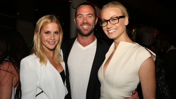 Aussie invasion ... <i>The Originals</i> star Claire Holt (left) and <i>Chuck</i>'s Yvonne Strahovski, flanked by Sullivan Stapleton (centre), star of the upcoming <i>300: Rise of an Empire</i> at Comic-Con's Superman 75th Celebration party.