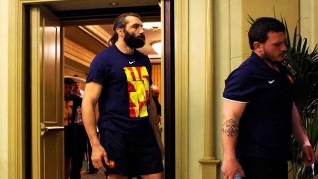 Sebastien Chabal (L) and Thomas Domingo leave a room after a meeting with head coach Marc Lievremont.