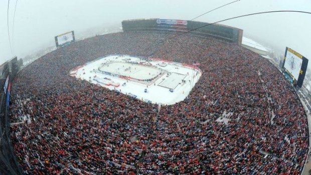 A record crowd watches the Detroit Red Wings and the Toronto Maple Leafs play in the Winter Classic, Jan. 1, 2014.