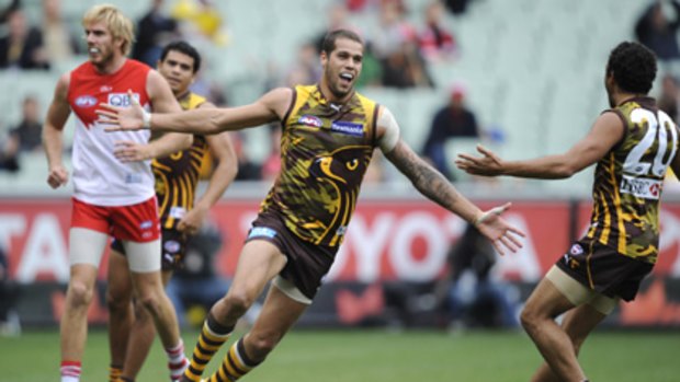Buddy beautiful .... Lance Franklin takes off for a jig after scoring one of his three goals.