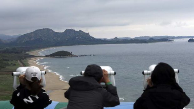 Keeping watch: South Koreans look at North Korean territory at an observation post just south of the demilitarised zone separating the two Koreas.