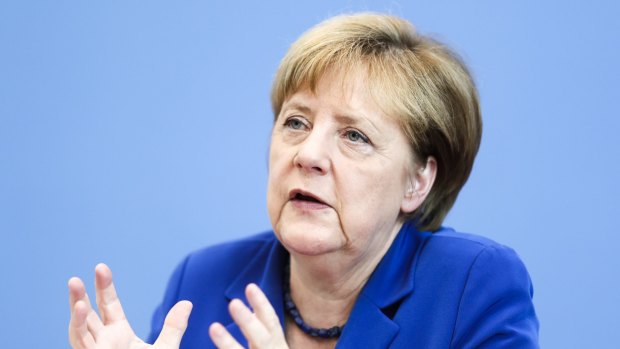 German Chancellor Angela Merkel addresses the media on Thursday.