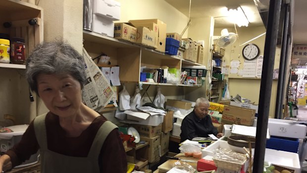 Noriko Sekine and her husband Sho-ichi Sekine at the back of their fruit stall in Tokyo. 