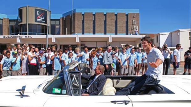 Sit back and relax . . . Mark Webber is paraded around his home town of Queanbeyan yesterday.