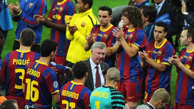 Sir Alex Ferguson congratulates Barcelona players on their win.