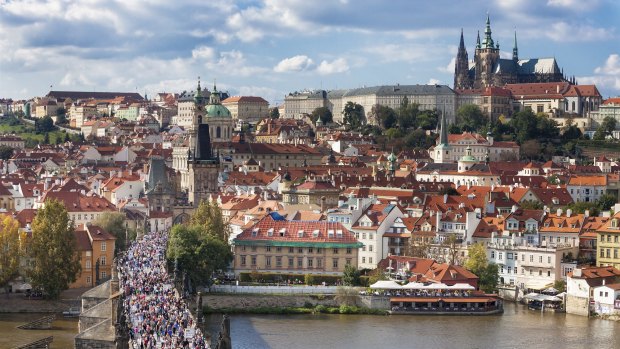 Charles Bridge over the River Vltava is one of Prague's  major tourist attractions.