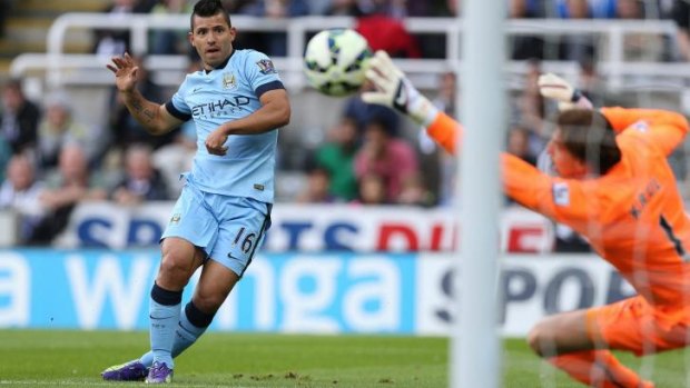 Manchester City's Argentinian striker Sergio Aguero scores at St James' Park on Sunday.