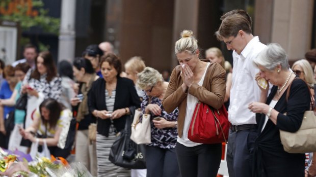 Relatives of siege victim Katrina Dawson gather in Martin Place on Thursday. 