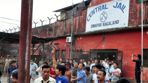 Stoned and beaten to death ... Members of a mob pull a man, centre with blooded face, accused of rape, out of the Central Jail where he was held in Dimapur, in the northeastern Indian state of Nagaland. 