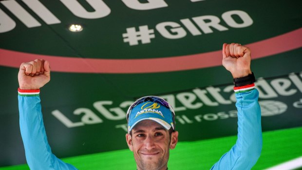 Italian rider Vincenzo Vincenzo Nibali celebrates on the podium after winning the 19th stage of the Giro d'Italia.