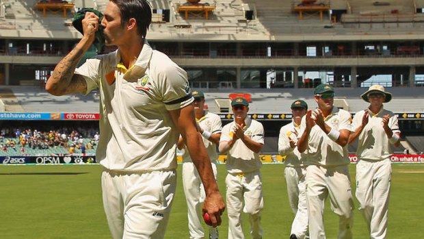 Mitchell Johnson of Australia kisses his cap as he leads his team from the field.
