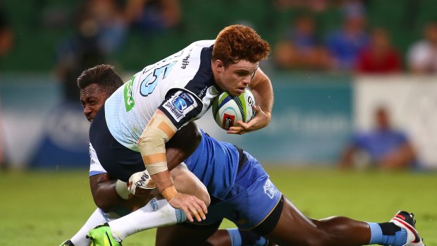 Rising star: Andrew Kellaway of the Waratahs is tackled by Solomoni Rasolea of the Force in Saturday's Super Rugby match at nib Stadium in Perth. 