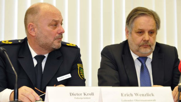 Police President Dieter Kroll and public prosecutor Erich Wenzlick speak to the media about the recent murder case.