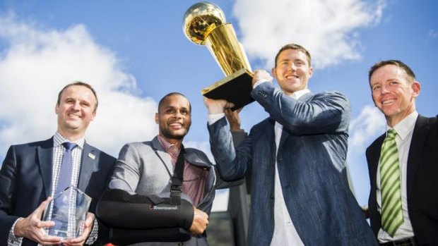 Andrew Barr, Patrick Mills, Aron Baynes, and Shane Rattenbury with the Keys to the City and NBA Trophy.